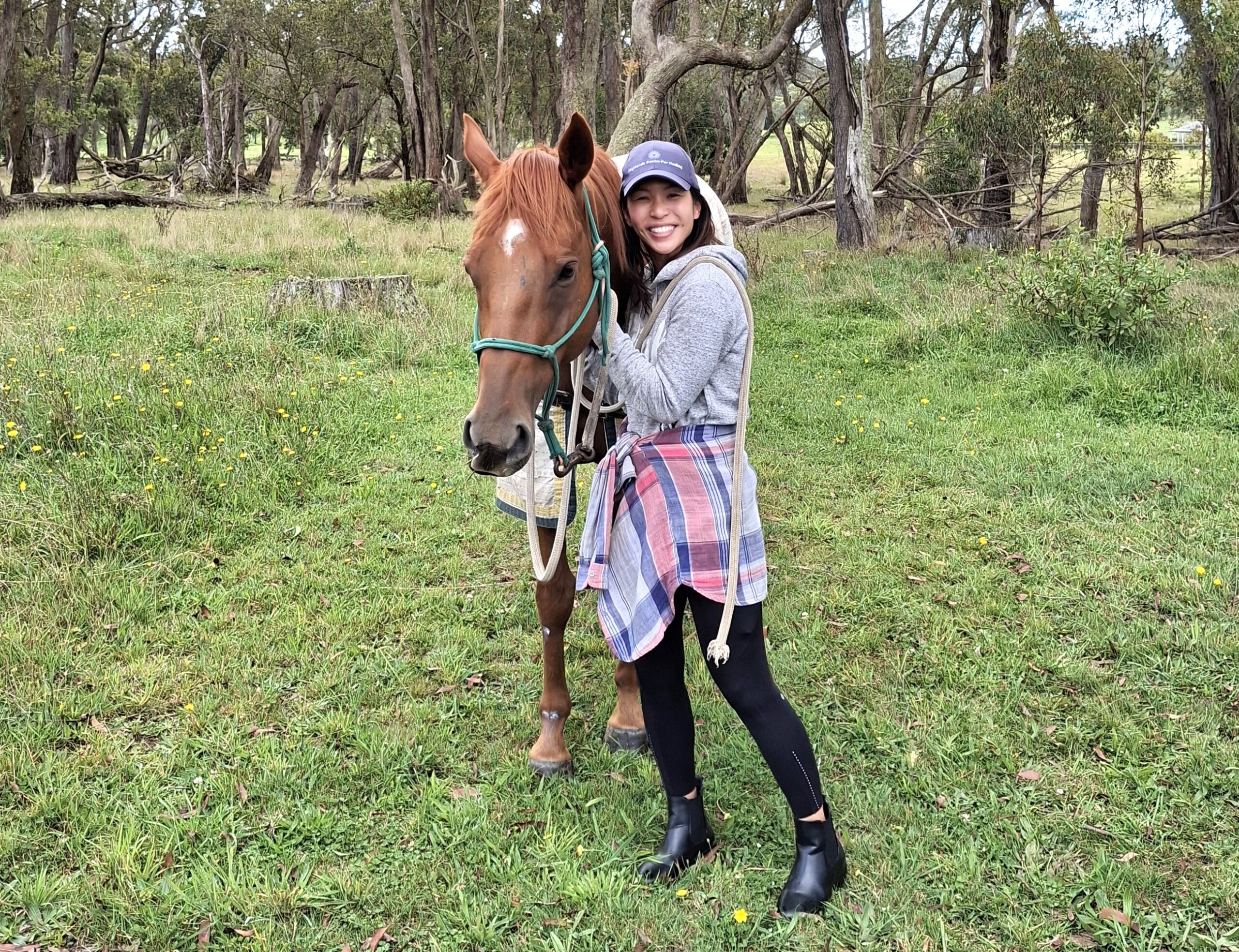 woman with horse in forest