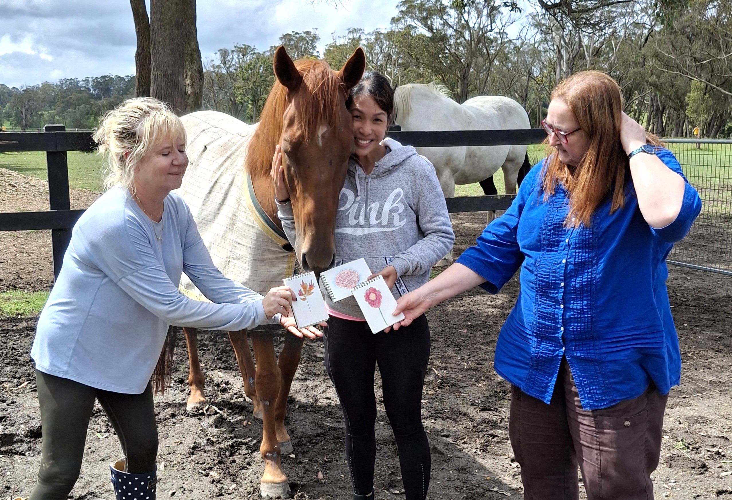 women with horse and artwork